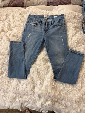 Frame Denim Light Wash Skinny Jeans with Subtle Distress